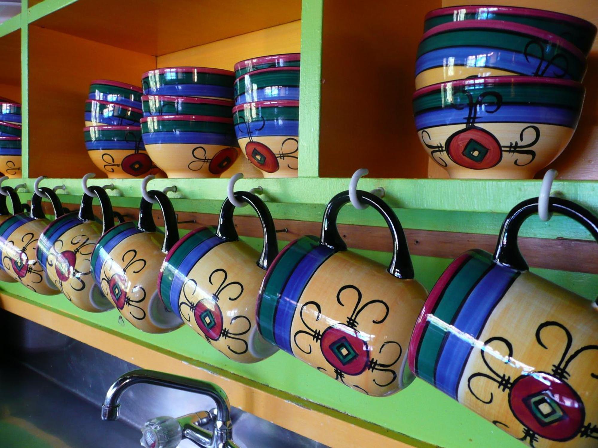 Global Village Travellers Lodge Греймут Экстерьер фото A typical display of coffee mugs at a Panera Bread