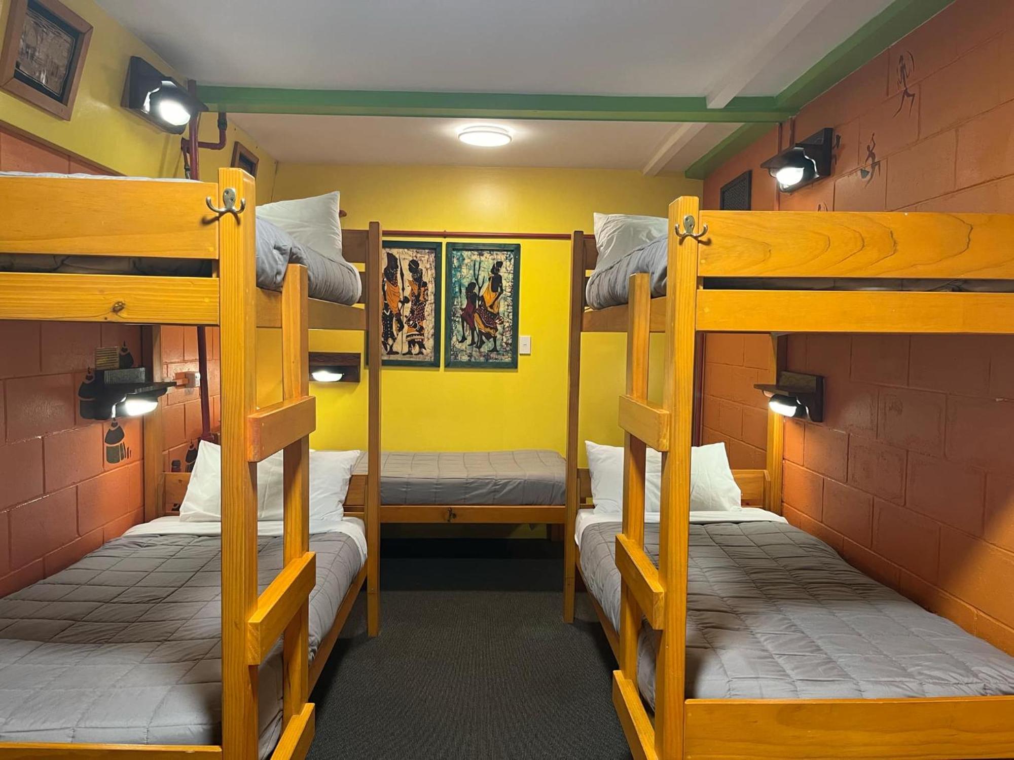Global Village Travellers Lodge Греймут Экстерьер фото A bunk room at a hostel in New Zealand